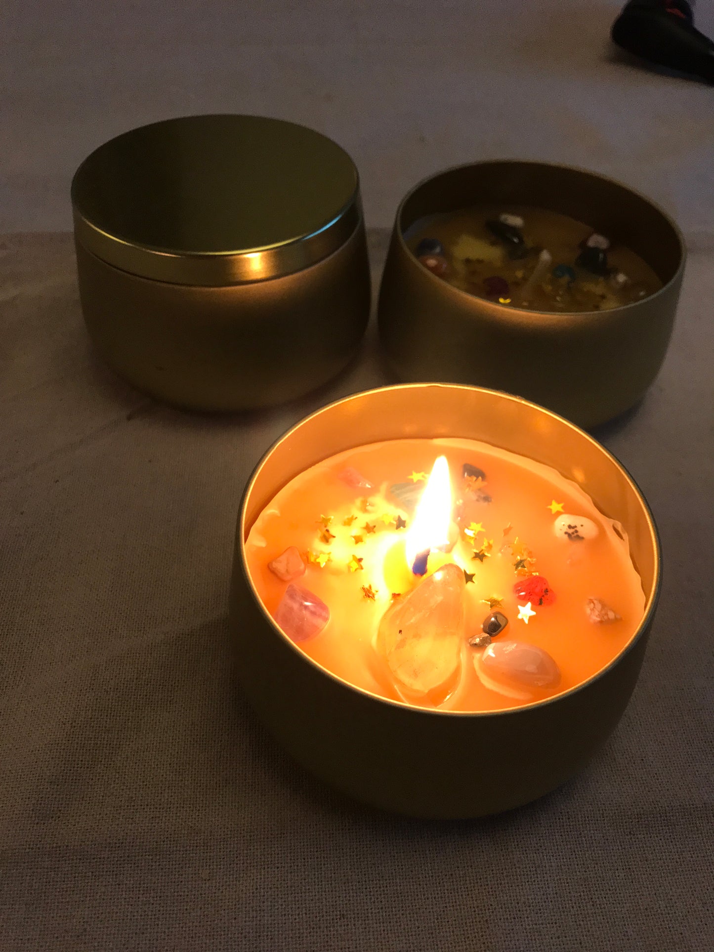 beeswax candle in golden tin