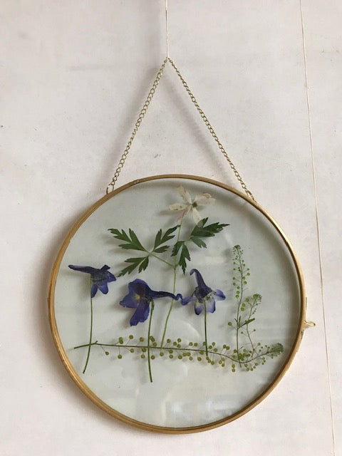 brase  frame with dried flowers